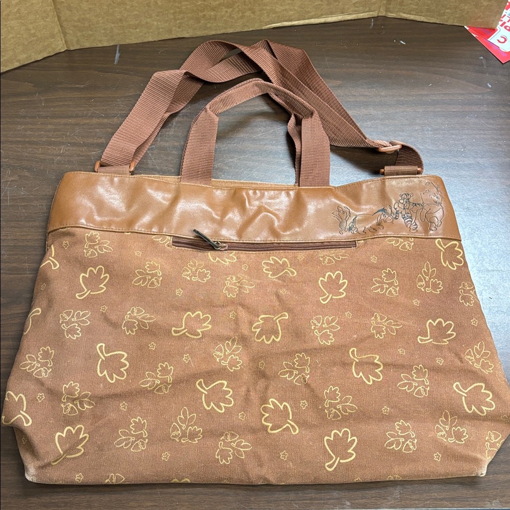 Brown Winnie the Pooh tote bag adjustable straps zipper ontop is broken 18”X14”
